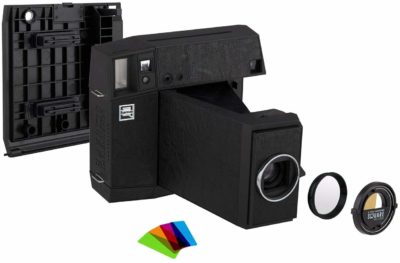 This is an image of a black LOMO instant camera bundle kit.