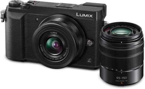 This is an image of a black Panasonic LUMIX GX85 4K Digital Camera with 12-32mm and 45-150mm Lens, 16 Megapixel sensor and 3-Inch Tilt and Touch LCD, 