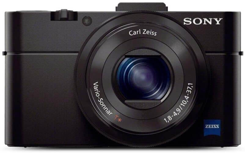This is an image of a black Sony RX100 digital camera with 20.2 megapixel CMOS sensor, 28-100mm lens and 3 inch TFT lcd display