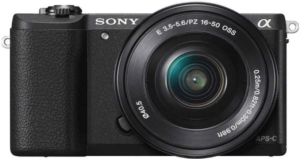 This is an image of a black Sony a5100 camera with 16-50mm Lens and 3-Inch Flip Up LCD 