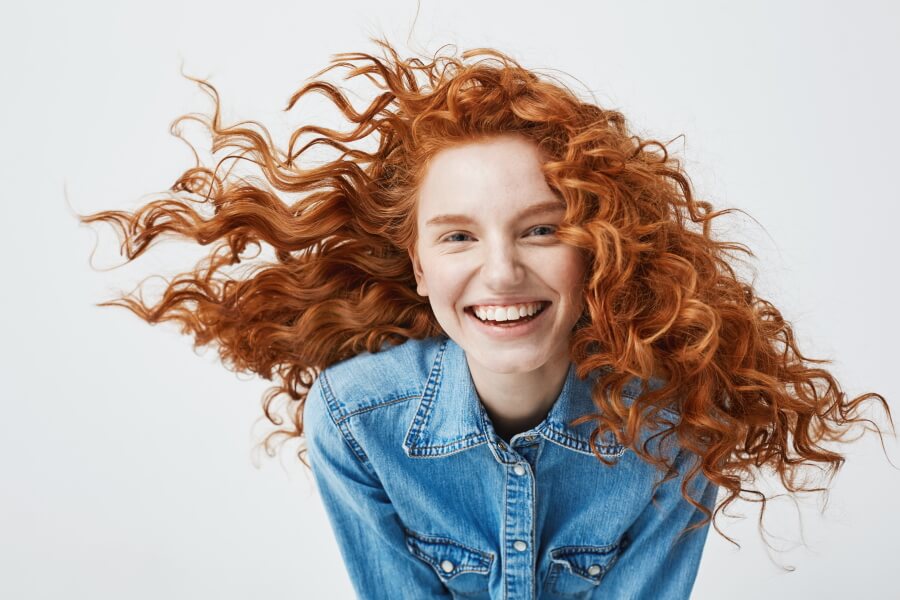 Portrait photo of a smiling redhead girl
