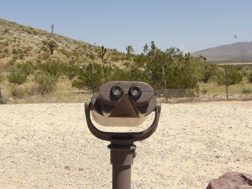 Kodak PIXPRO AZ528 sample of viewing binoculars in a desert landscape